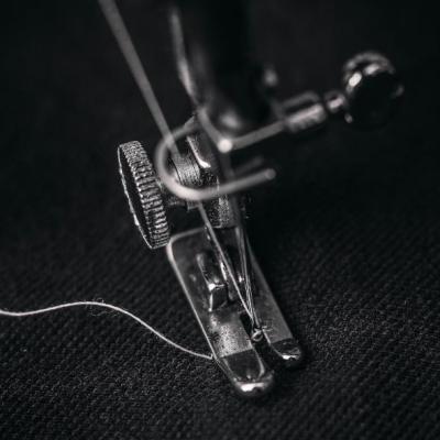 The needle and foot of a sewing machine