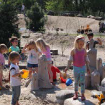 Children playing with water on a playground